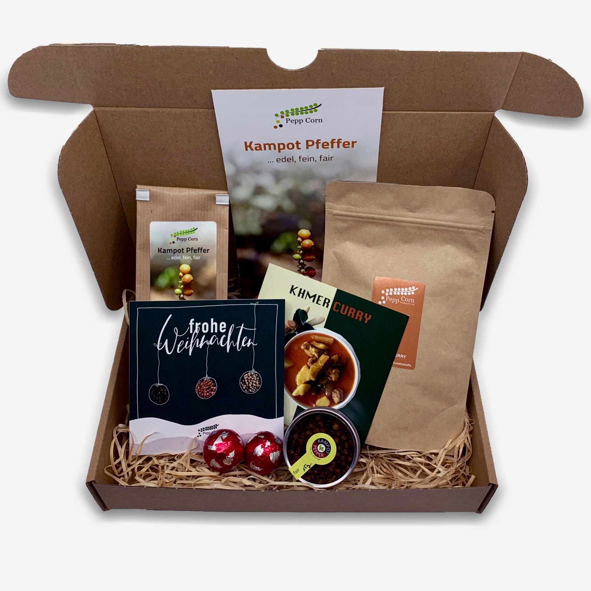 Weihnachtliche Geschenkbox mit Kampot Pfeffer, Khmer Curry und Weihnachtskarte